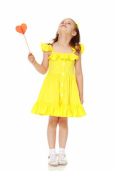 Little girl with a candy on a stick