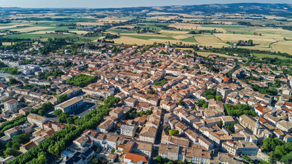 Aerial top view of residential area houses roofs and streets from above, old medieval town background, France
