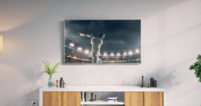 Tv set on the wall showing cricket game 