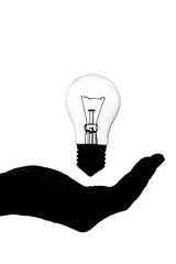 silhouette of a woman's hand with an incandescent lamp, thought bulb, concept of idea on white isolated background
