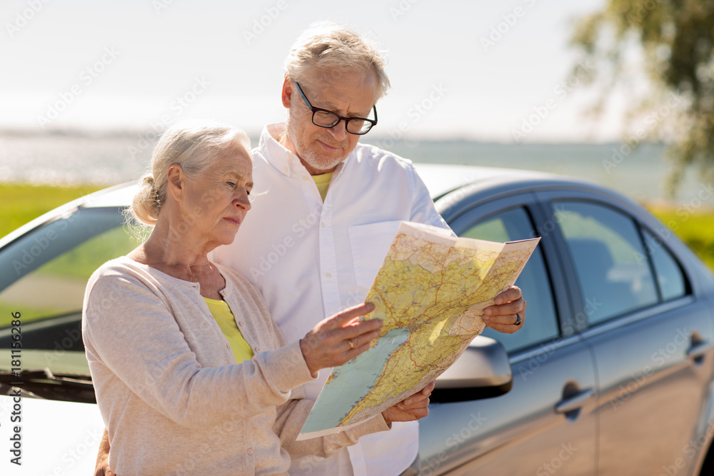 Canvas Prints senior couple with car looking for location on map