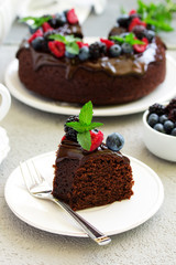 Chocolate cake with glaze and fresh berries