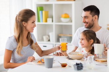 happy family having breakfast at home