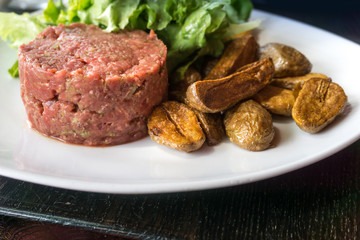 tasty Steak tartare (Raw beef) - classic steak tartare on white plate