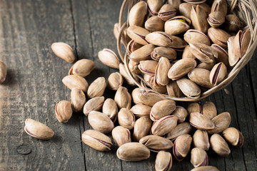 Healthy mix nuts on wooden background. Almonds, hazelnuts, cashews, peanuts, pistachios, brazilian nuts