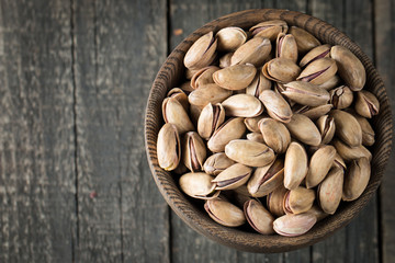 Healthy mix nuts on wooden background. Almonds, hazelnuts, cashews, peanuts, pistachios, brazilian nuts