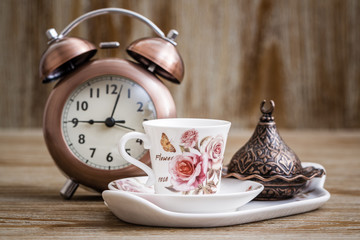 Obraz na płótnie Canvas Turkish Style Coffee Set and Alarm Clock