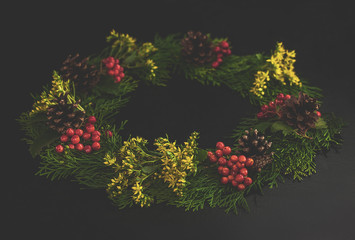 Christmas decorative wreath  with ornament isolated on white background. Made from thuja, flower,...