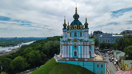 Aerial top view of Saint Andrew's church and Andreevska street from above, cityscape of Podol...