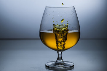 Wine liquid drops in glass high speed