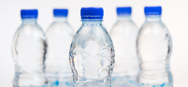 Plastic bottles of water isolated on white background