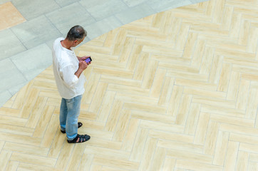 Top view of Full length of man with smart phone, Always connected concept