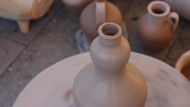 Creating a Traditional Ceramic Clay Vessel. Finishing the mouth of the jar