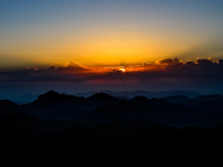Naklejka premium Holy summit of Mount Sinai aerial view, Aka Jebel Musa, 2285 meters, at sunrise, Sinai Peninsula in Egypt. Copy space. Sunrise background.