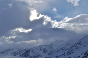 beautiful view of clouds crossing the mountain ridge. awesome mountain