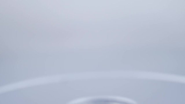 Hand takes white plate with colorful candied fruit and puts plate back empty