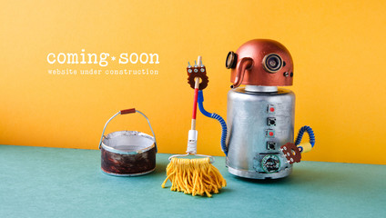Web site under construction Coming Soon template page. Robot washer with mop and bucket of water, orange wall green floor interior - 181164095