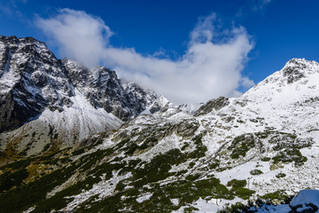 mountain tops in winter covered in snow