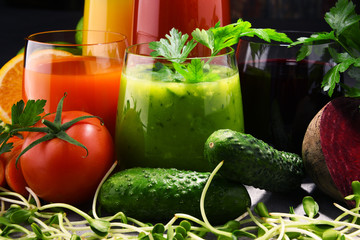 Glasses with fresh organic vegetable and fruit juices