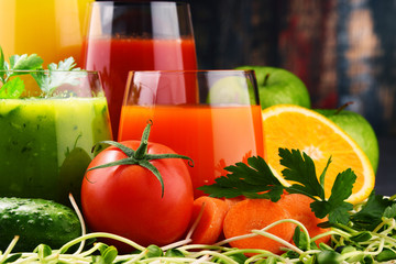Glasses with fresh organic vegetable and fruit juices