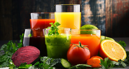 Glasses with fresh organic vegetable and fruit juices
