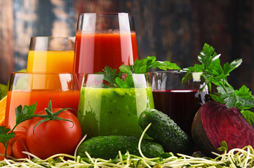 Glasses with fresh organic vegetable and fruit juices