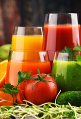 Glasses with fresh organic vegetable and fruit juices