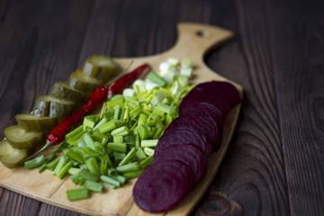 vegetables : onions, garlic, cucumbers, beets, chili peppers on the table