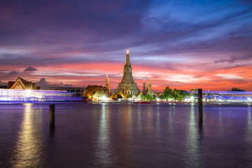 Fototapeta na wymiar Wat Arun Temple during sunset with dramatic sky in Bangkok, Thailand
