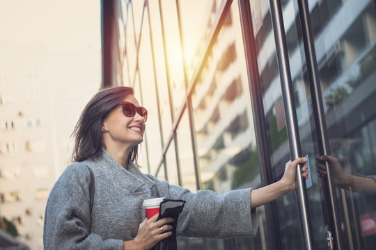 Happy Businesswoman Entering In Office Building.