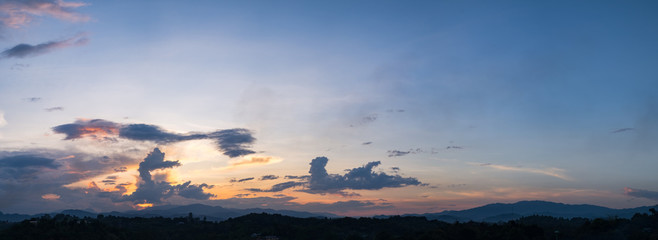 Obraz na płótnie Canvas Beautiful panorama of sunset with dramatic sky