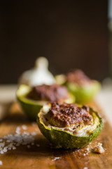 Stuffed round courgettes, with cow meat over a cutboard