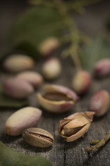 Pistachio with husk from Bronte Sicily on wood