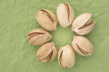 Sicilian pistachio on green background