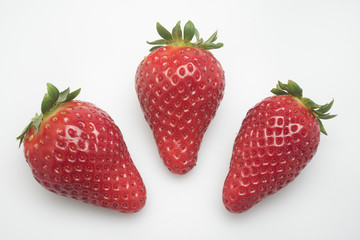 three strawberry on white background