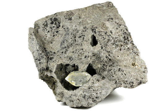 Herkimer diamond nestled in bedrock isolated on white background