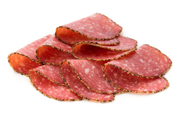 Salami slices isolated on the white background.