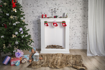 White New Year's interior with fireplace and green tree