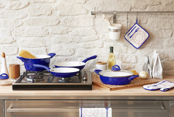 dark blue pan set in the kitchen