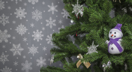 Christmas tree on a gray background with snowflakes