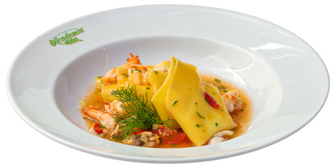 Ravioli with shrimps and tomato sauce isolated on white background