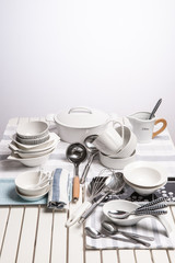 decorated cookware set on the wooden white table