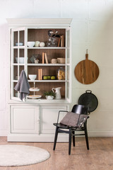 kitchen cupboard white concept with black decorative chair