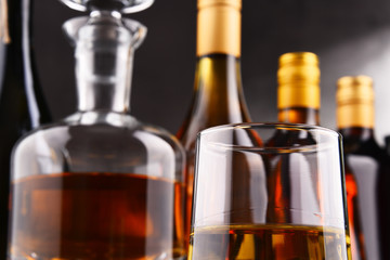 Carafe and bottles of assorted alcoholic beverages.