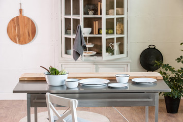 beautiful plates on the table in the white kitchen style