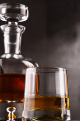 Composition with glass and carafe of hard liquor