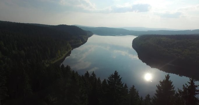 Aerial Drone Moving sideways over beautiful landscape with trees and river  in eibenstock Germany 4k