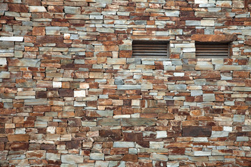 Colored Brick texture wall, with two venting narrow windows