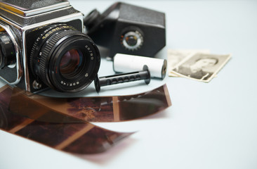 Old photo camera with photo film rolls and cassette
