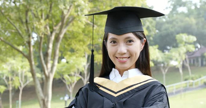 Student woman graduating in the campus